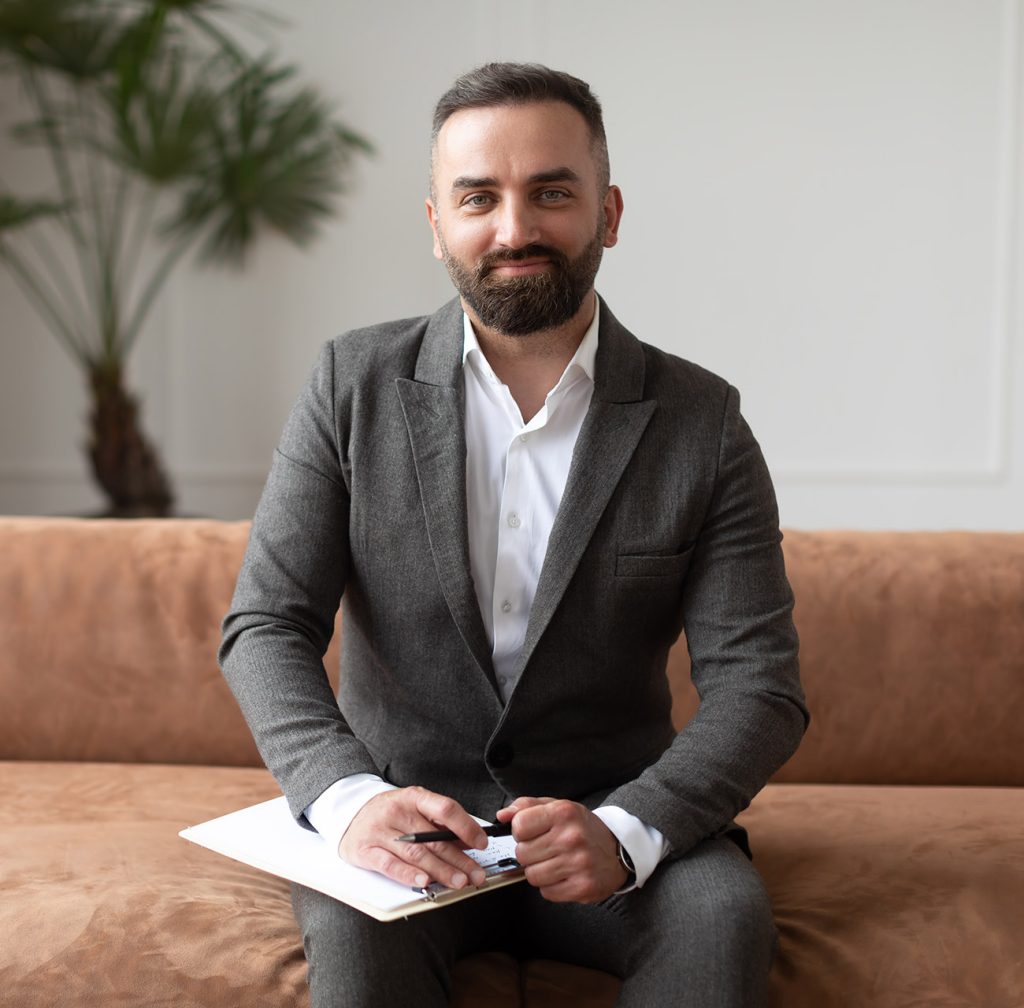 portrait-of-confident-male-therapist-in-suit.jpg